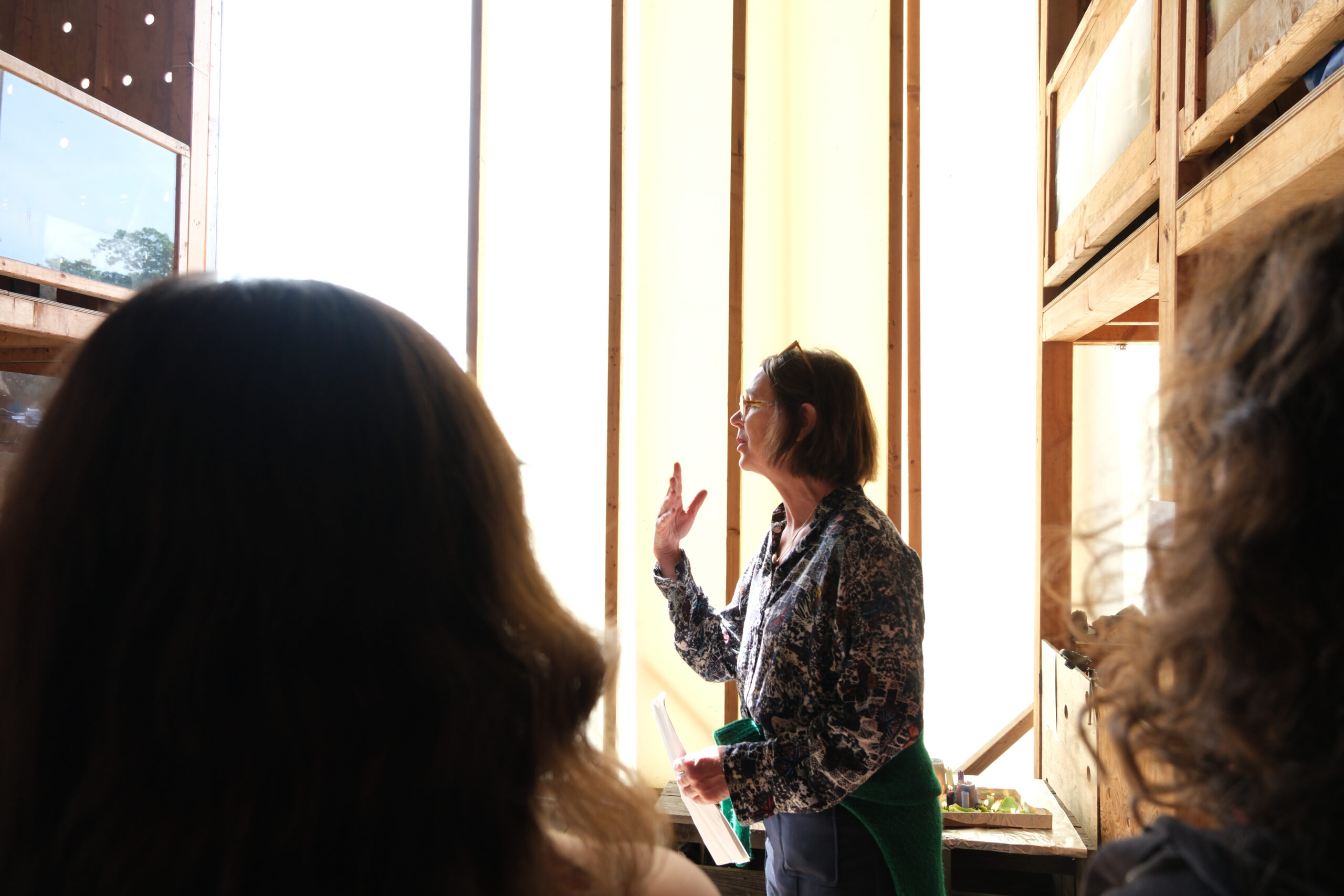 research-creation-exhibit_2025-23 Marion Detjen talking to visitors of the "We Threw Open the Doors" exhibition