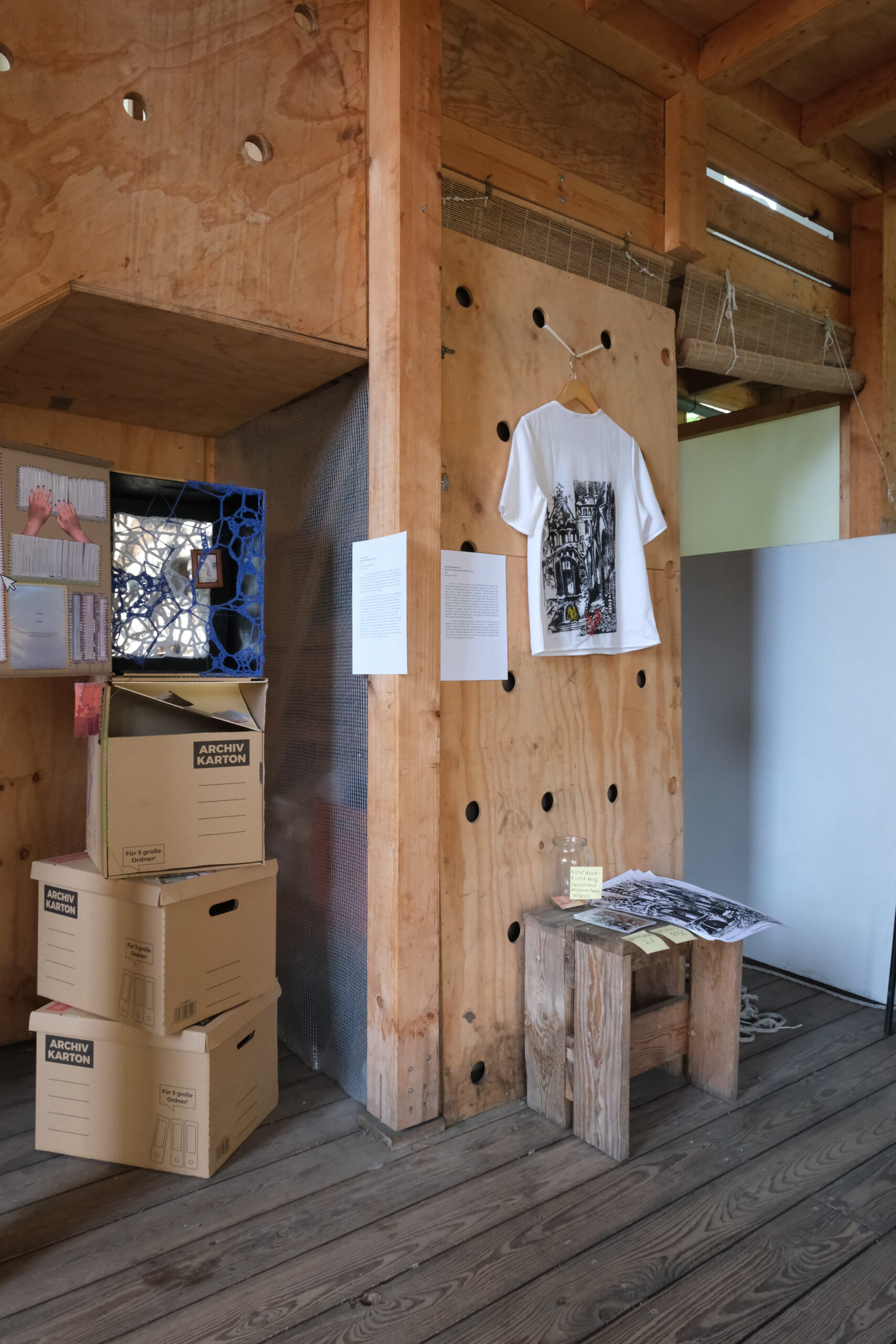 research-creation-exhibit_2025-32 Student work that involves a print on a T-shirt at the "We Threw Open the Doors" exhibition